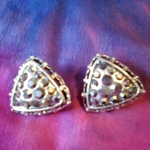 Silver Tone Triangle Shaped Clip On Earrings with Metallic Rhinestone Accents.